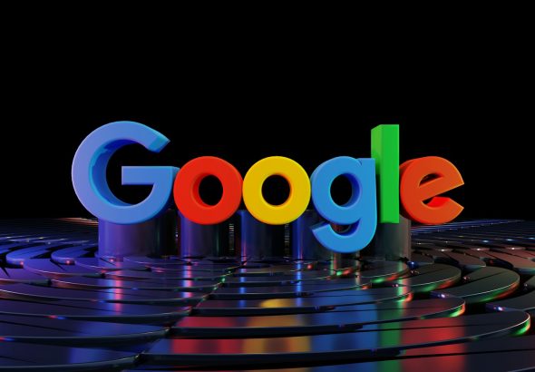 the google logo is displayed in front of a black background